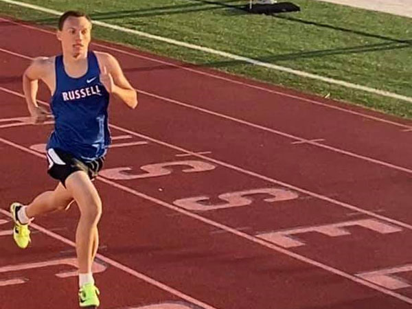 Russell High School sophomore Marcus Koetkemeyer running in Thursday's Russell Invitational at Shaffer Field.