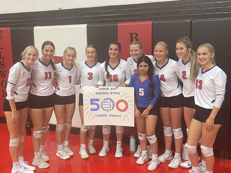 Russell's Marissa Myers and her teammates gathered for a picture after Myers recorded her 500th career assist during Thursday's triangular in Ellsworth.