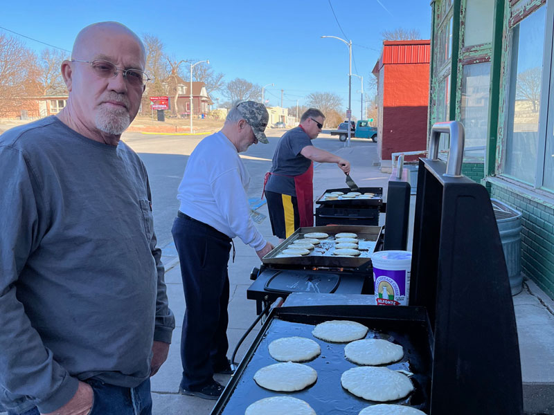(L-R) Natoma Mayor Rick Dunlap, David Kertz and Dale Eickhoff flipped pancakes during the annual Lions Club pancake community benefit for the Dan Prowse family. (Photograph by Linda Crawford)